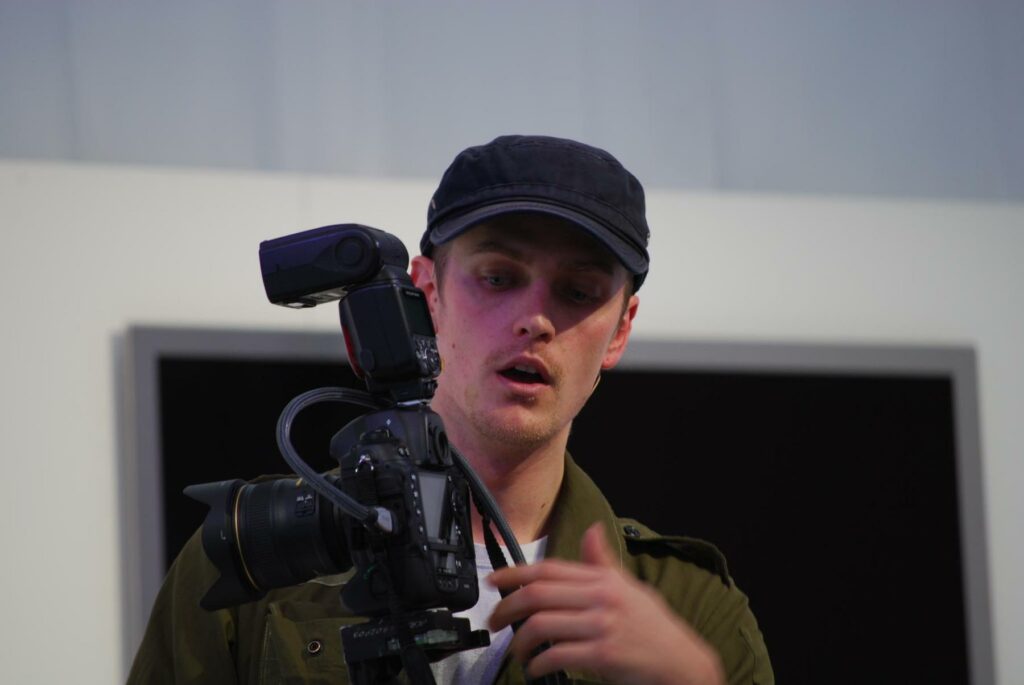 File:Christian Blanchard explains movie-making with the D3s - Nikon School, MSFW 2010.jpg - a man ho