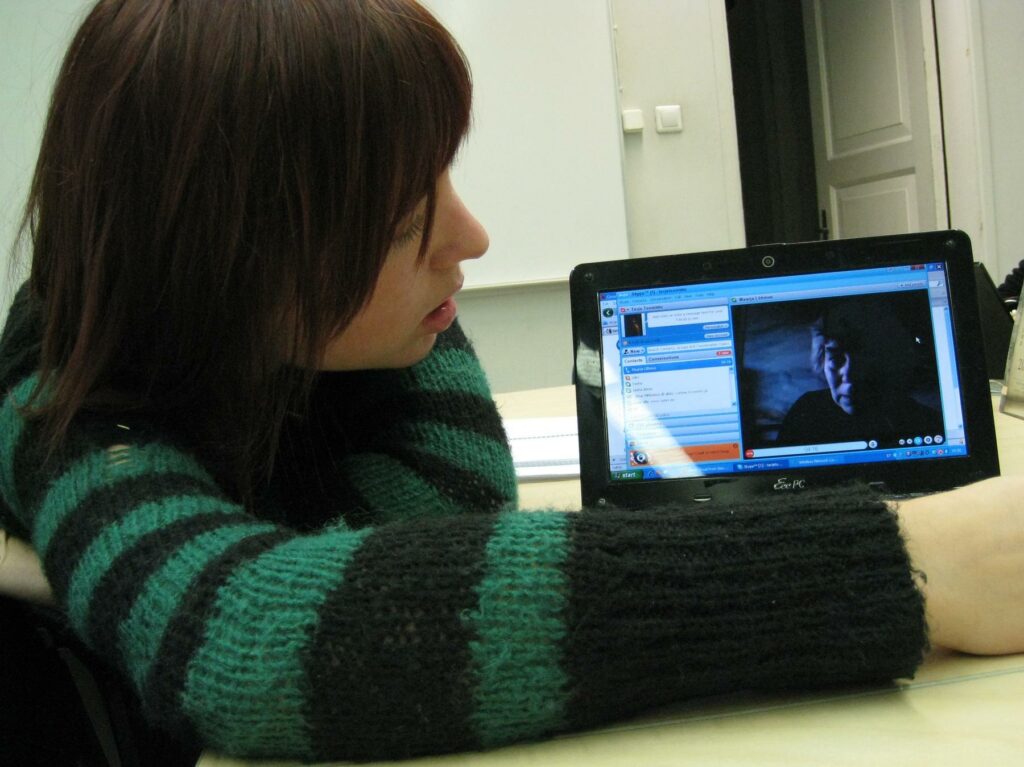 File:Seminar on Media Semiotics 2.jpg - a woman sitting at a table with a laptop