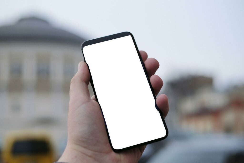 Free hand holding a smart - Image of Entertainment, An image of a person holding a smartphone